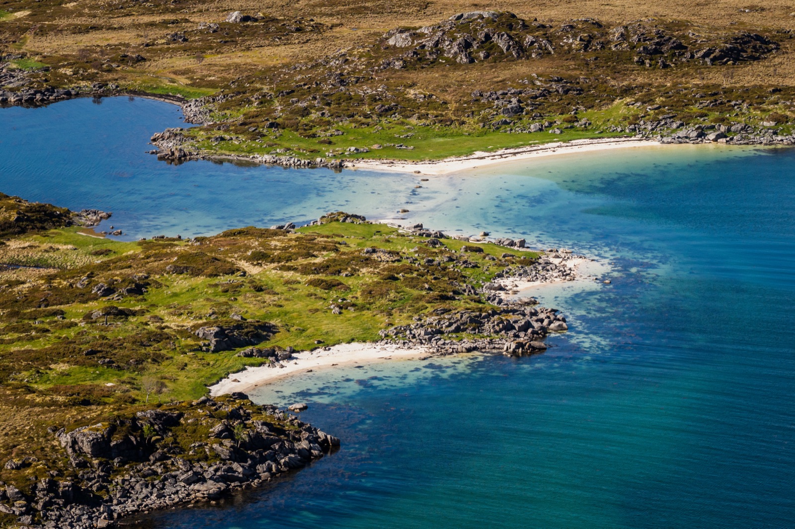 Drone view of white-sand beaches and turquoise water near Leknes