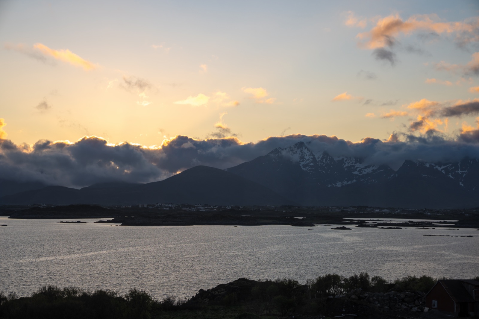 Evening view over the water towards Leknes and the peaks of Vestvågøy